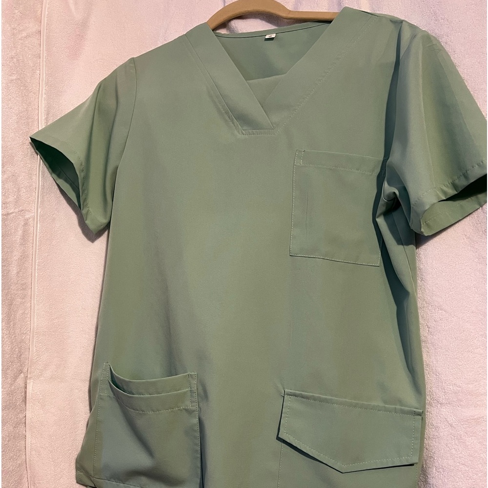 CMA uniforms very light minty green. No return
